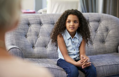 Young girl having therapy with a child psychologist